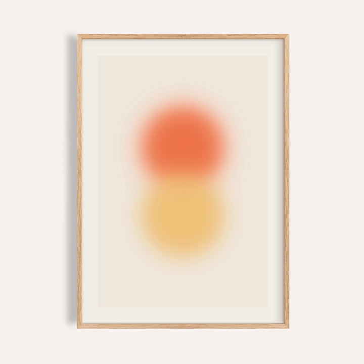 Orange and yellow wall art with a tangerine orb stacked above an amber orb