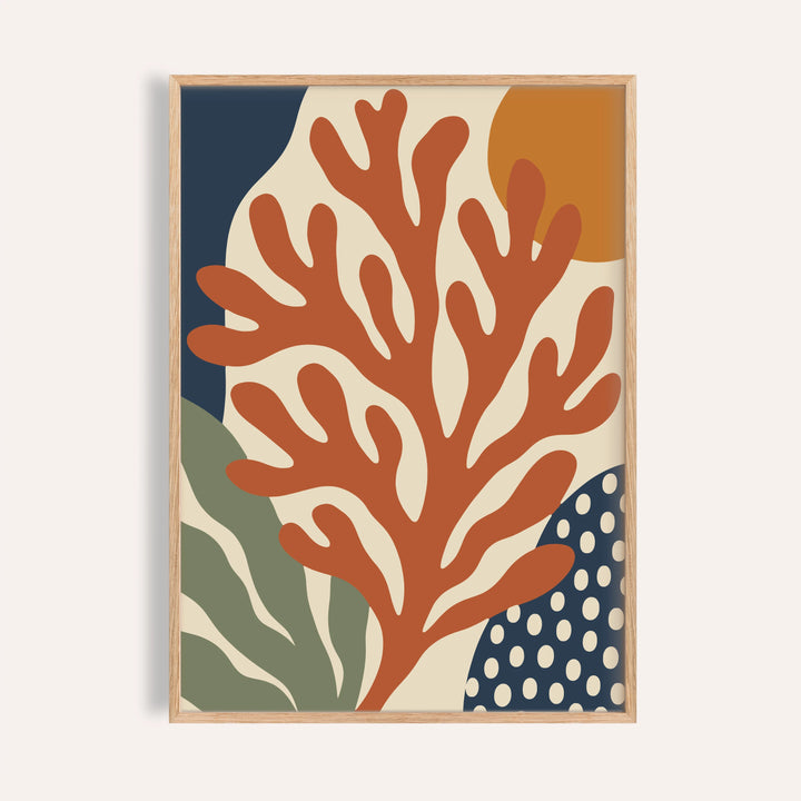 Coral wall art with an orange sun shown on a plain warm wall
