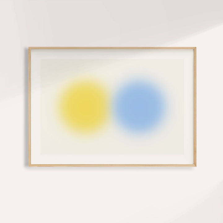 Abstract minimal print with a lemon yellow orb beside a sky blue orb
