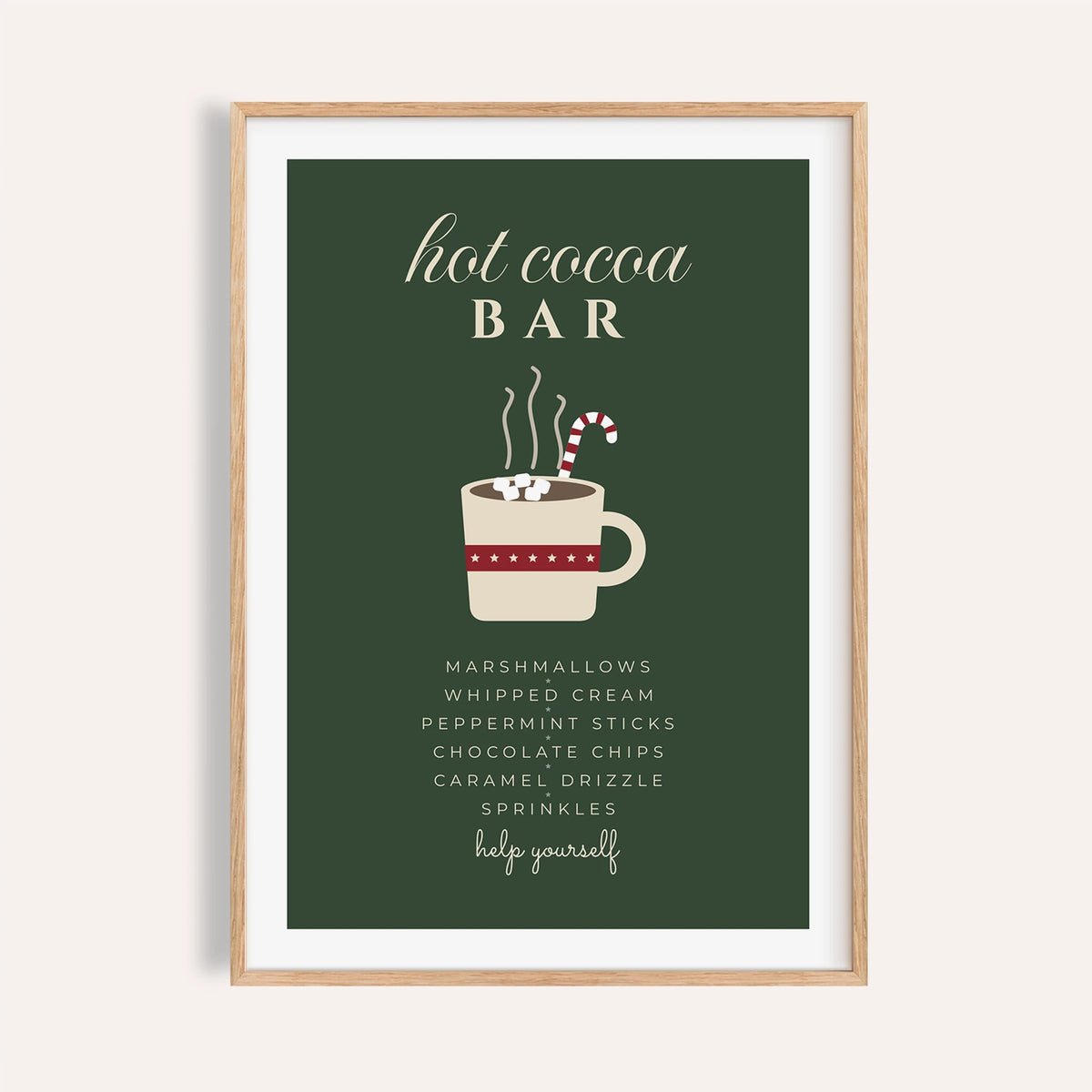 Green hot cocoa bar sign print shown on a plain warm wall