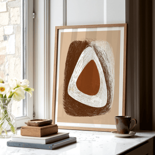 Organic Minimalist Wall Art leaning on a white marble window sill with books and a cup nearby