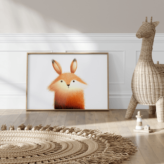 Cute Fox Poster print leaning on a floor by a wicker giraffe and a textured rug in a bright room