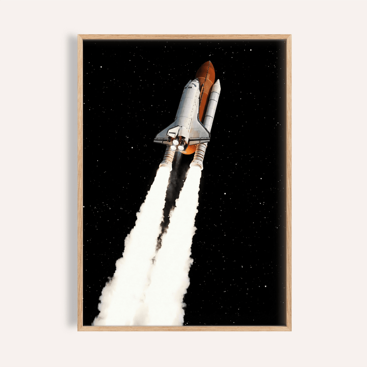 Framed Rocket Launch wall art showing a space shuttle launch with smoke trails against a black starry sky