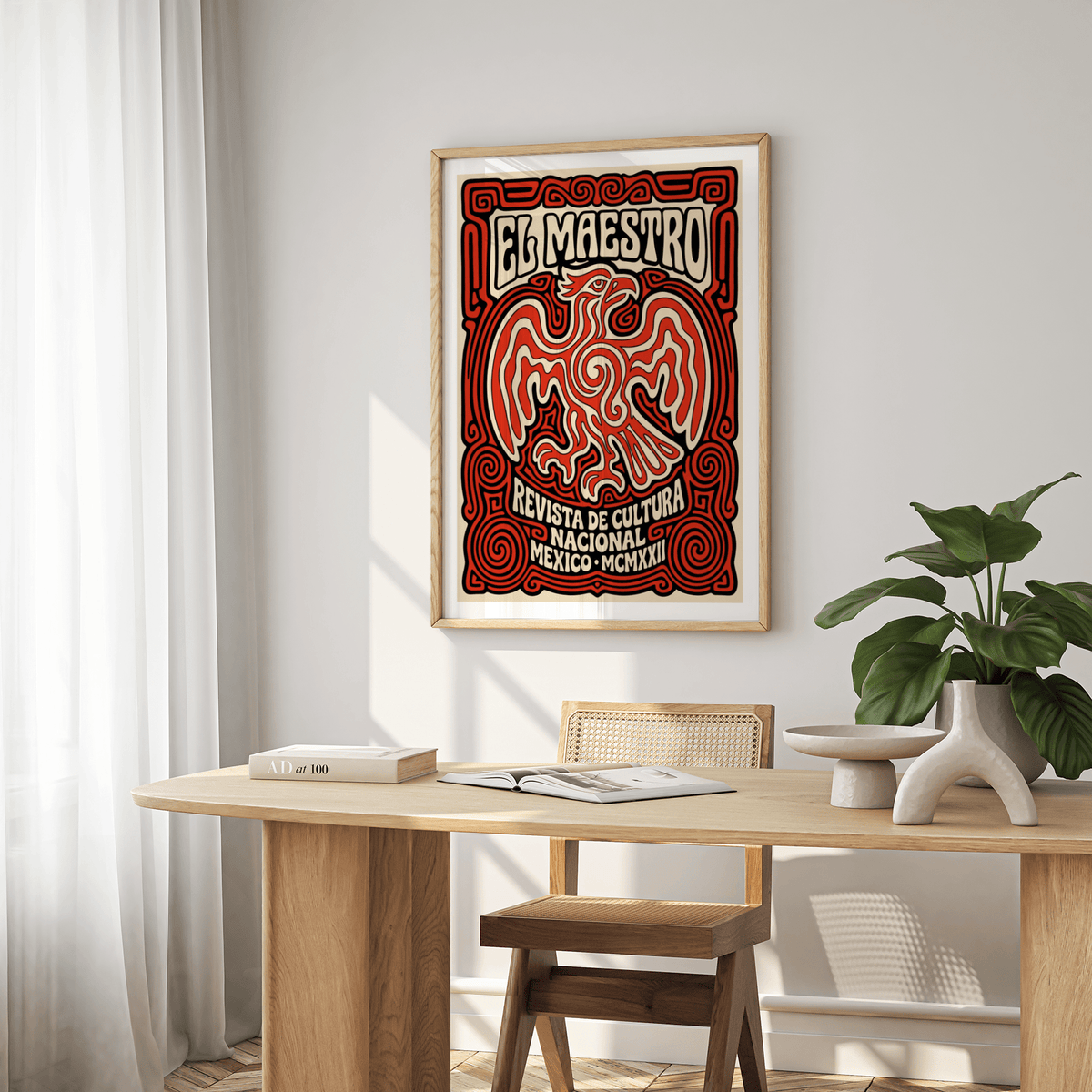 Cultural Mexican Poster print with red and black Mexican eagle illustration above a wooden dining table with a plant