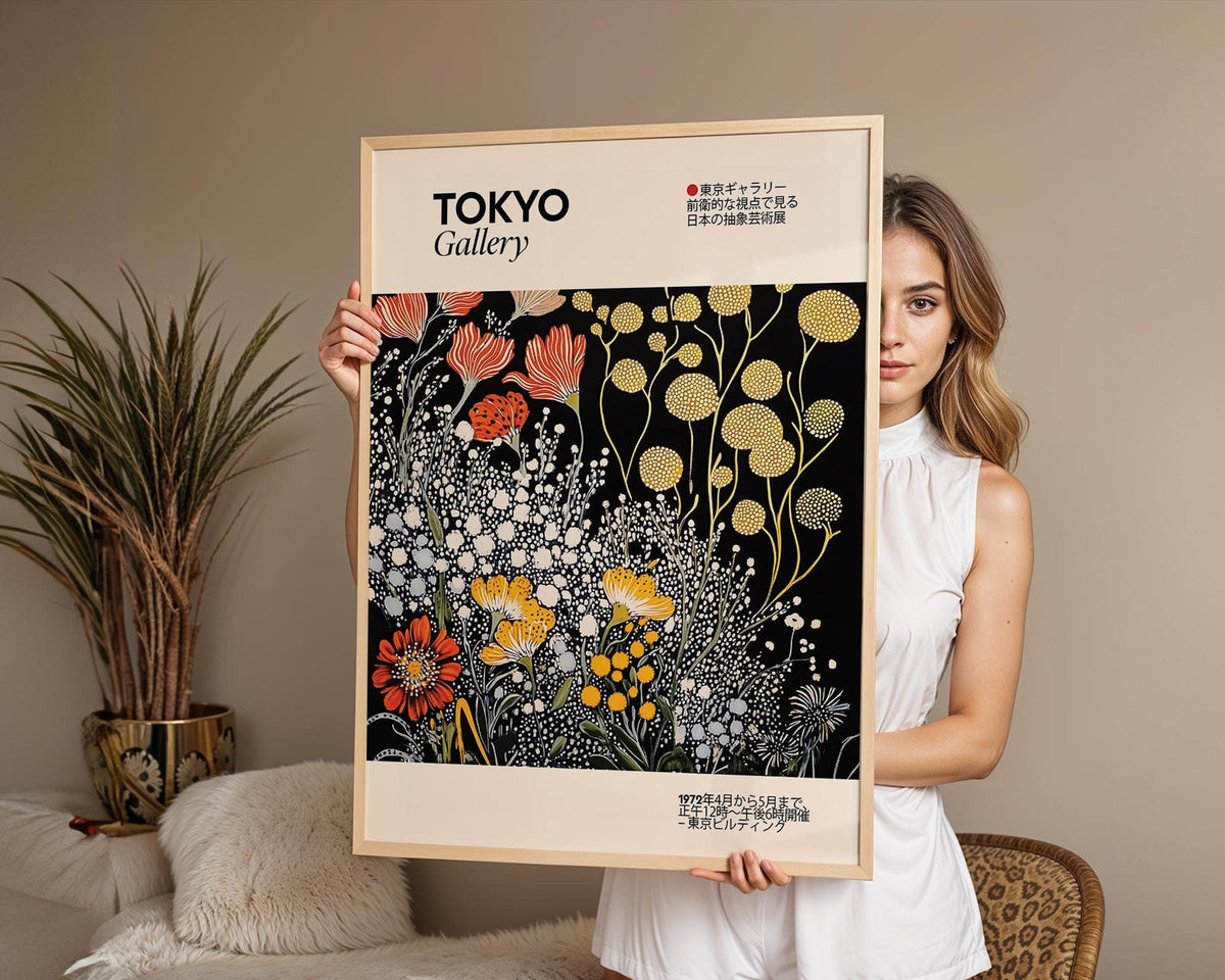 Vintage Japanese wall art with stylised flowers in yellow red and white held by woman in neutral room