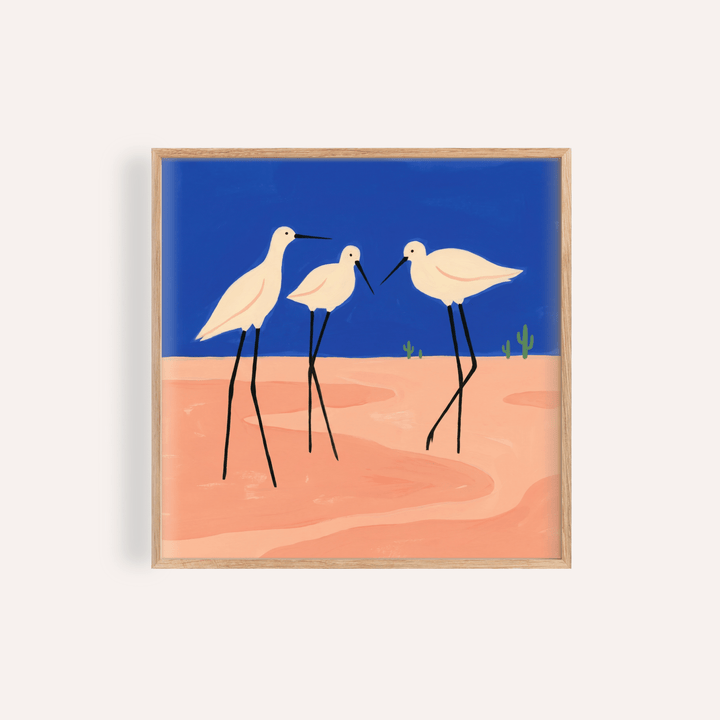 Framed Birds Minimalist Wall Art with white wading birds on blue and peach background