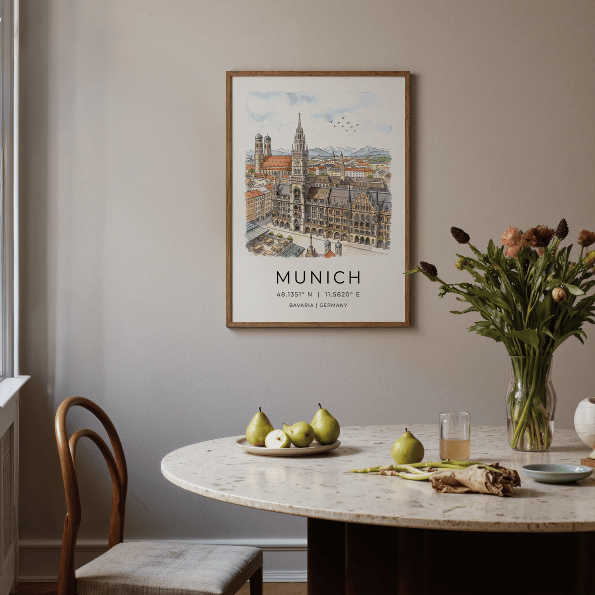 Munich City wall art of city skyline in watercolour hung above a dining table with pears and flowers