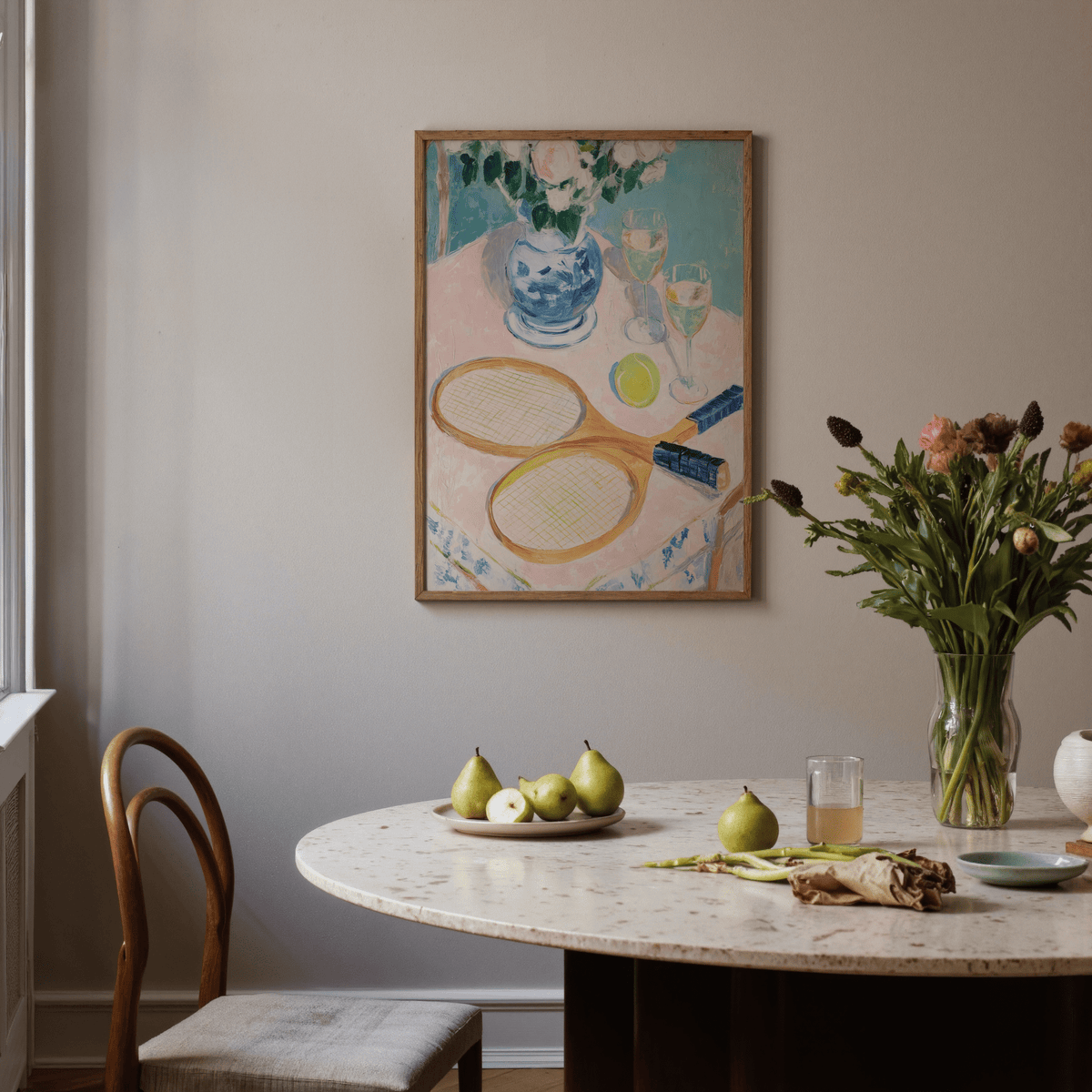 Tennis Still Life Print on a white wall above a dining table with pears and flowers