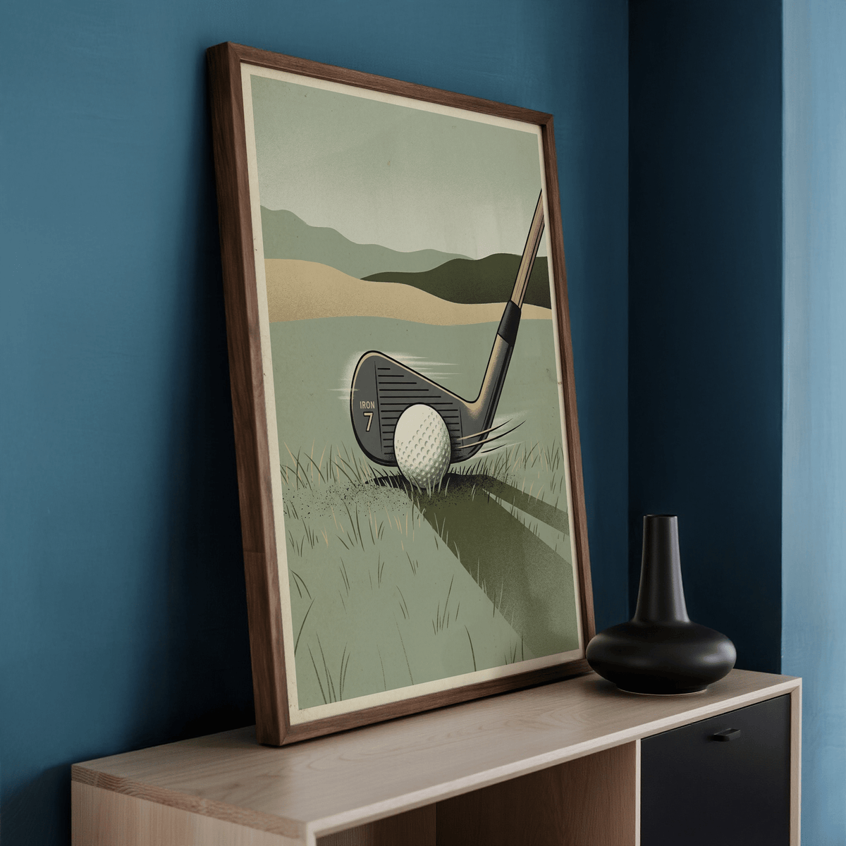 Framed Golf Iron Seven Print with a minimalist green and beige illustration leaning on a cabinet with a dark vase