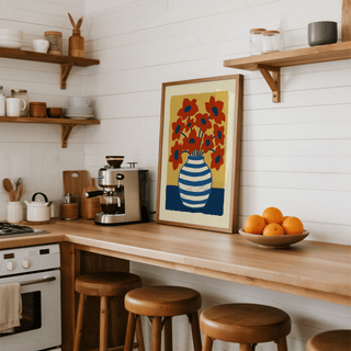 Framed Vase Poster leaning on a kitchen counter with wooden stools and oranges beside it