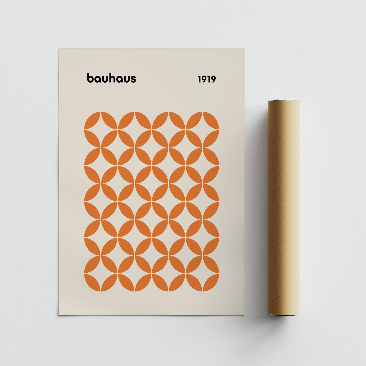 Orange Minimalist Print with orange circle pattern and bauhaus text beside packaging tube