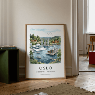 Print leaning on floor of Oslo City Art Print showing Oslo waterfront scene in watercolour style with green book stack nearby
