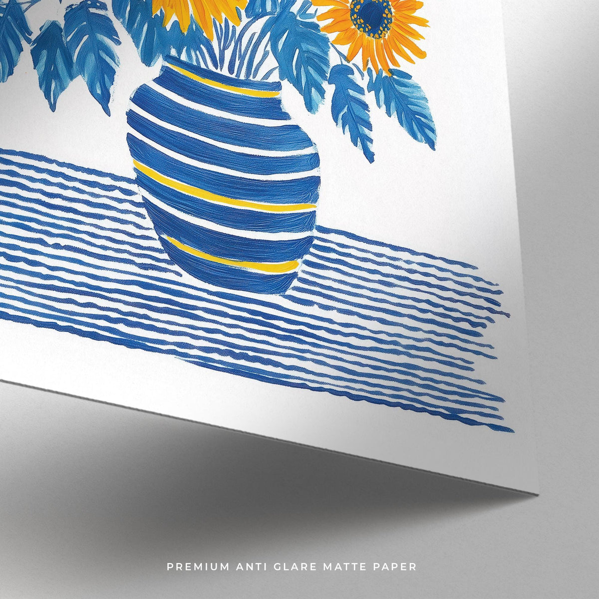 Close-up of Sunflower Print with blue and yellow vase and striped tablecloth on matte paper
