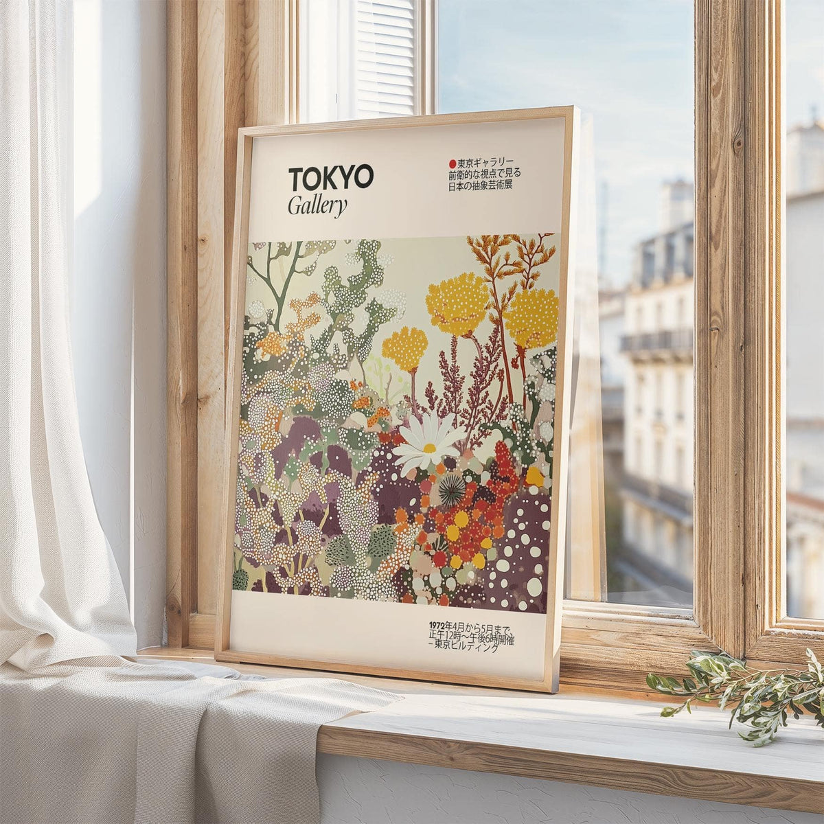 Print leaning on a window ledge showing a vintage floral print with yellow and purple abstract flowers