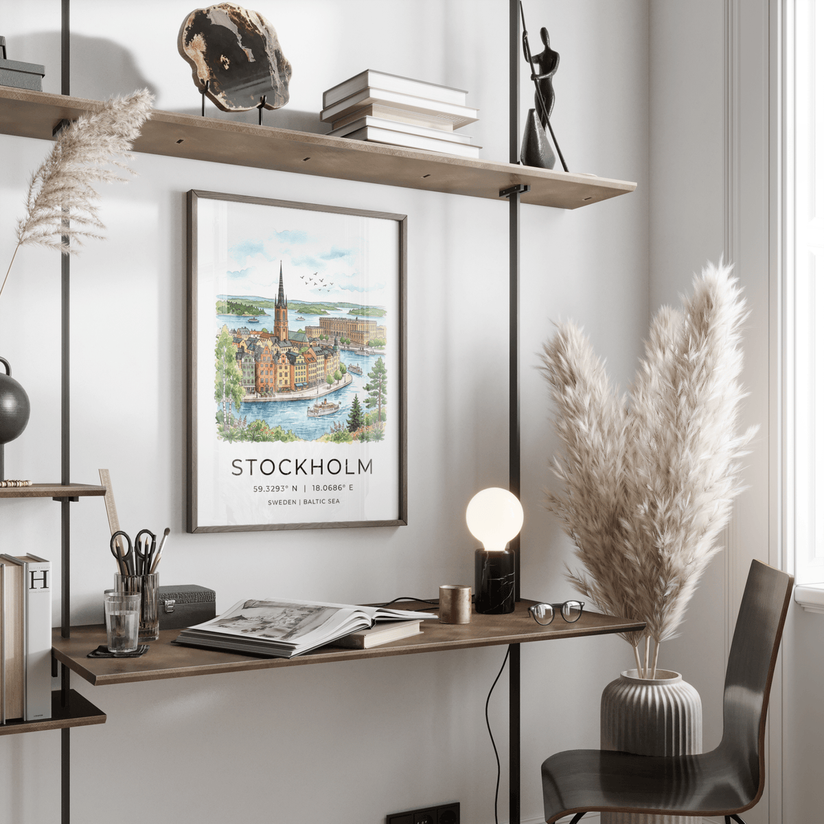 Stockholm City Art Print in watercolour style hanging above a desk with a lamp in a light room
