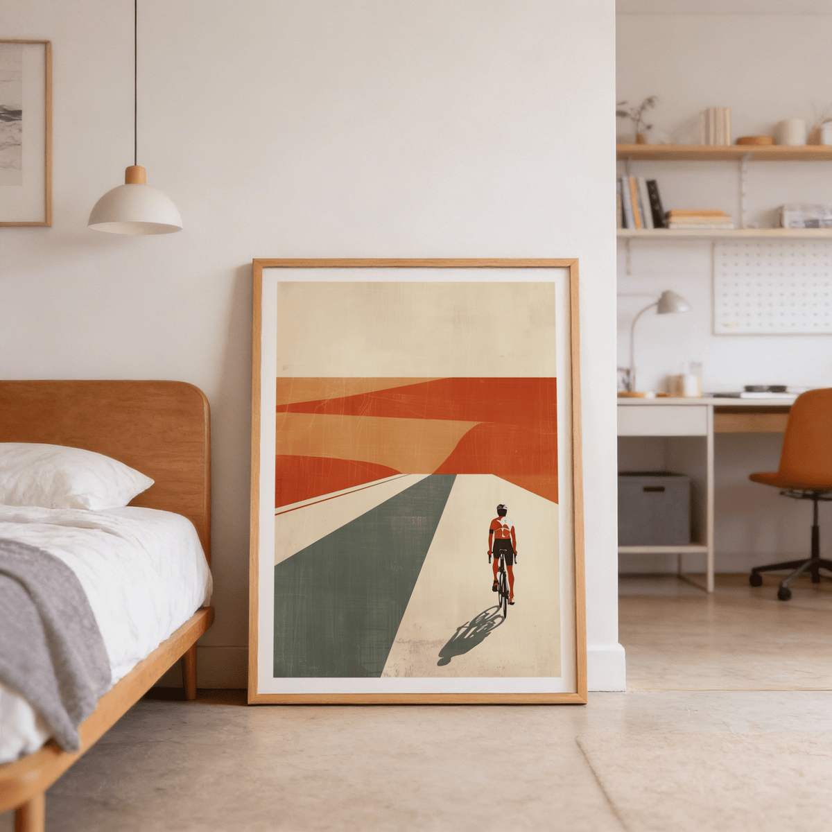 Print leaning on floor of Cycling Landscape Print minimalist mid-century cyclist in orange desert scene