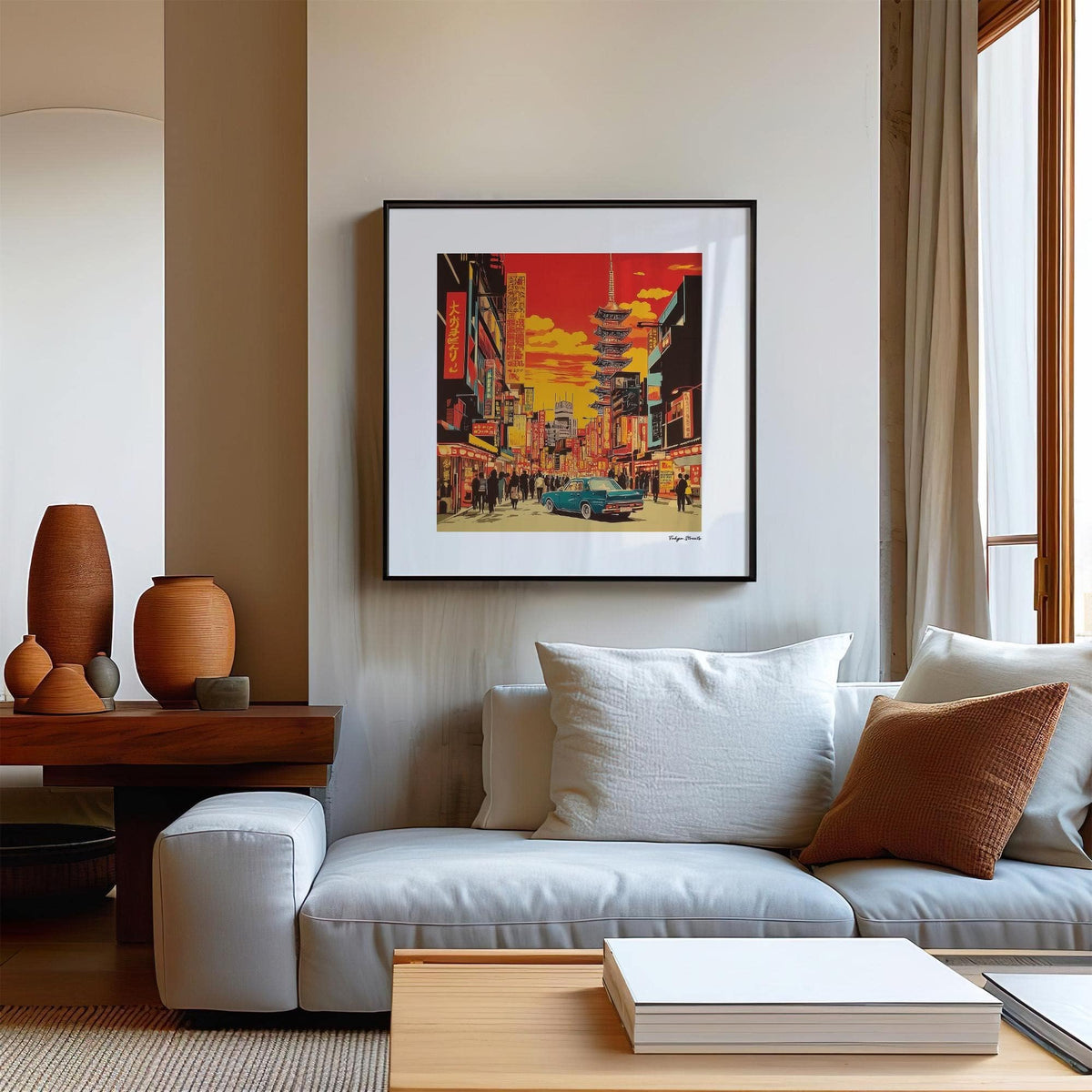 Print on a wall of a retro Tokyo street scene with a red sky above a white sofa