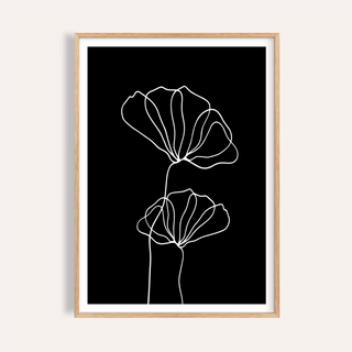 Framed Line Art Floral Print of two white line-art flowers on a black background
