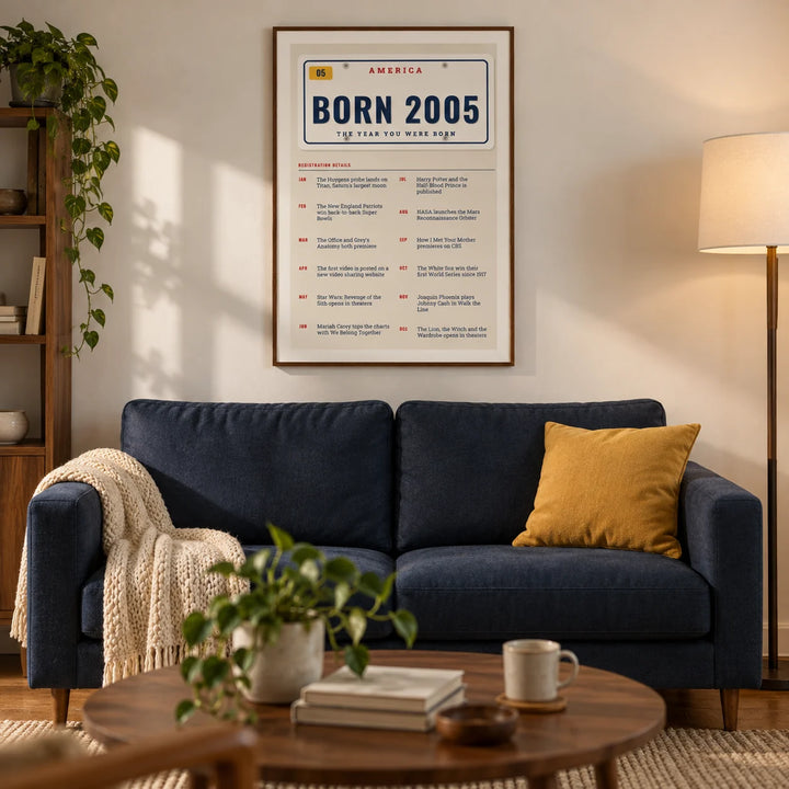 2005 License Plate Print, framed on the wall of a compact modern living room in a young adult's UK first flat with warm white walls and walnut furniture