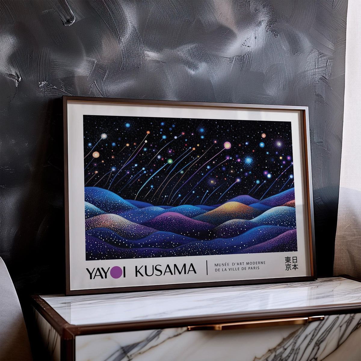 Landscape print shooting stars over hills with blue and purple tones leaning on a marble table