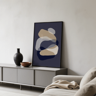 Abstract Art Shapes print leaning on a grey sideboard with a black vase and brown bowl in a living room