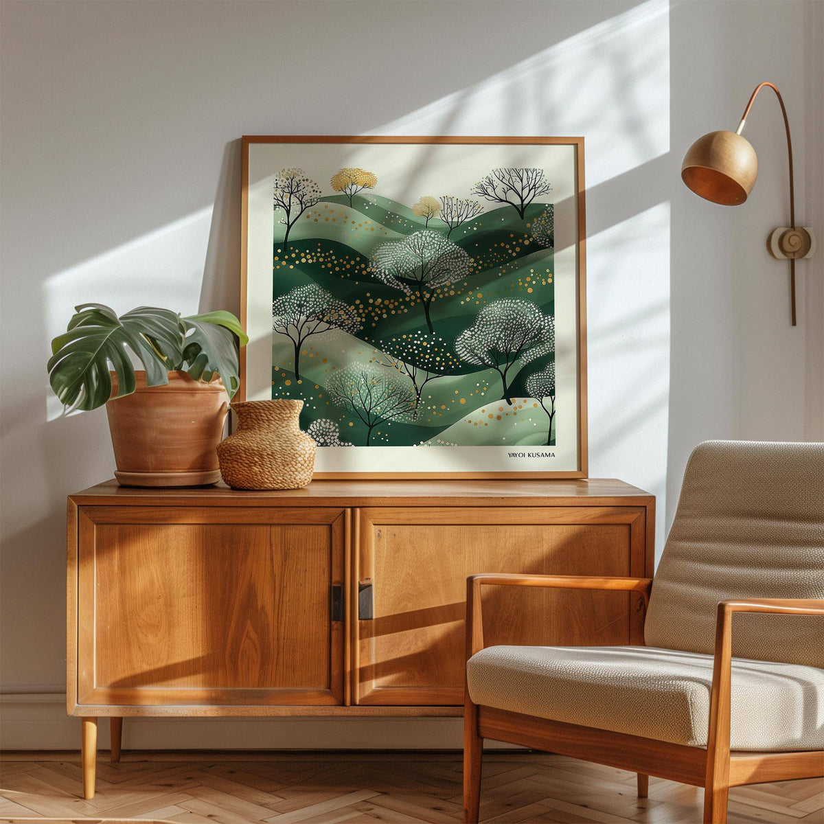Wall Art Green stylised green hills with dotted trees framed on wooden cabinet with plant pot in sunlight