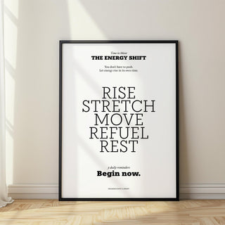 Print leaning on a floor with posters with inspirational sayings in black and white and light wall shadows