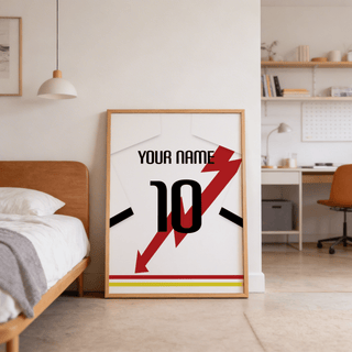 Print leaning on the floor of a bedroom featuring a white football shirt with red lightning bolt and black number 10