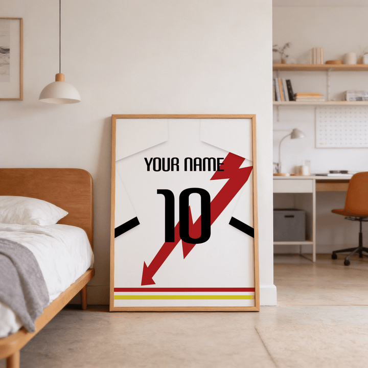 Print leaning on the floor of a bedroom featuring a white football shirt with red lightning bolt and black number 10