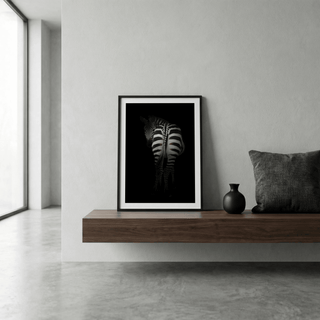 Framed Zebra Art Print of a zebra rear view with black and white stripes on a shelf with a black vase