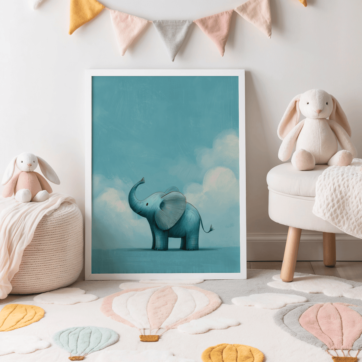 Nursery Animal Poster leaning on floor with blue baby elephant and clouds in soft pastel nursery