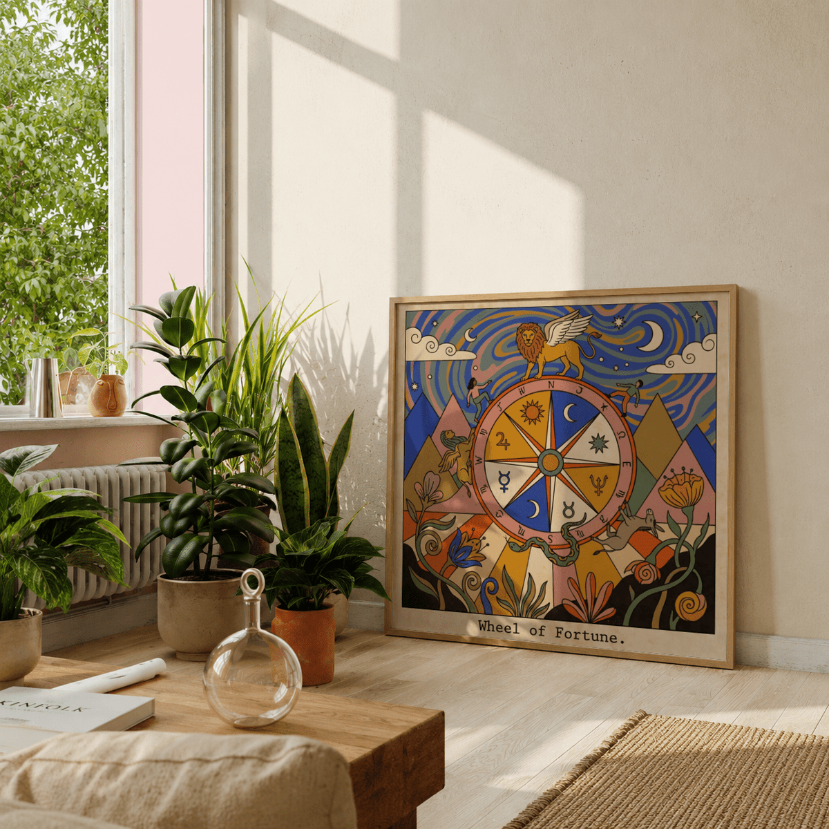 Wheel Of Fortune Tarot Card Art print leaning on a floor with plants and soft natural light