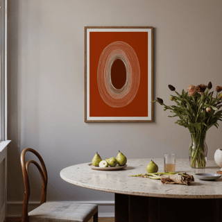 Abstract line drawing poster of concentric oval lines in brown and white above a dining table with pears and flowers