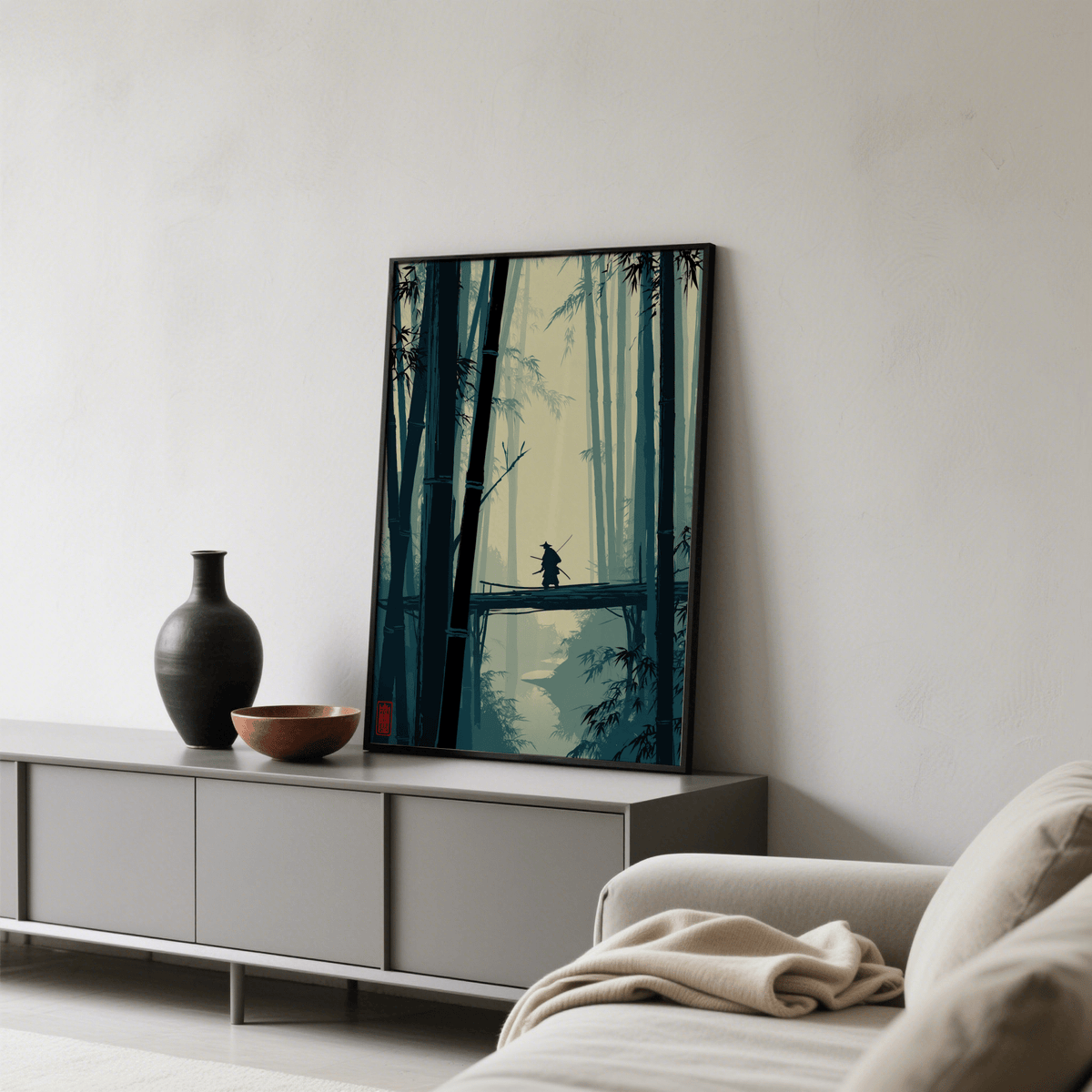 Japanese Bamboo Art Print leaning on a cabinet with a vase and bowl in a neutral living room