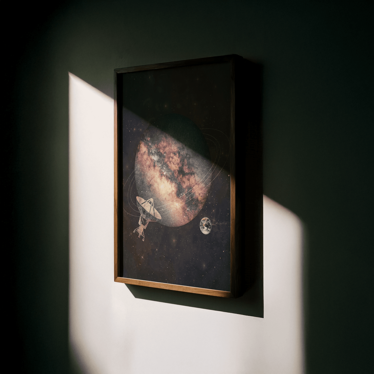 Framed Cosmic Art Print showing a space planet and satellite dish in abstract collage style with pink and dark blue