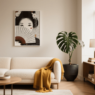 Japanese Geisha Art print on a living room wall with beige and black tones near a large plant