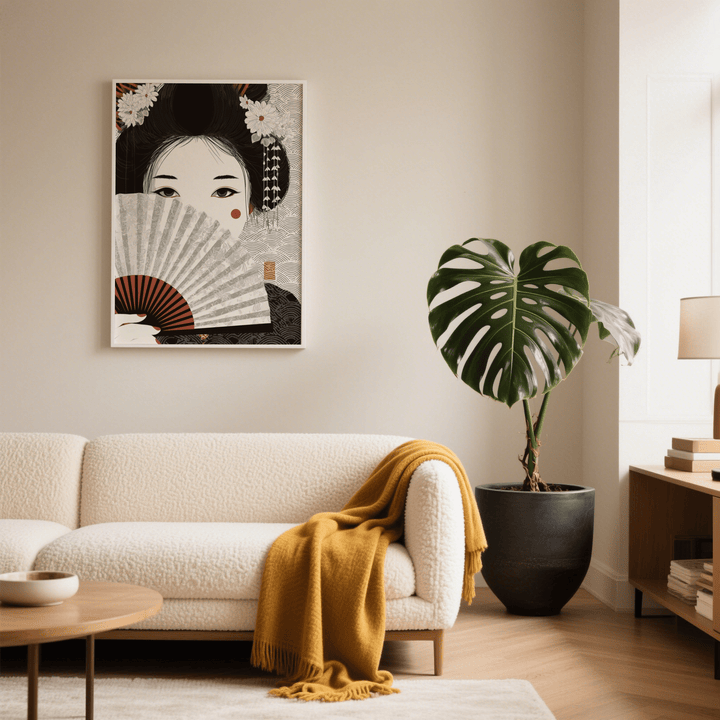 Japanese Geisha Art print on a living room wall with beige and black tones near a large plant