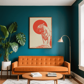 Bold Tiger wall art in orange and cream above an orange sofa with a green plant on the side