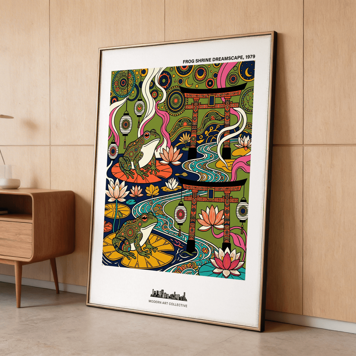 Japanese Frog Art Print print leaning on floor showing decorated frogs on lily pads and Japanese torii gates near wooden sideboard