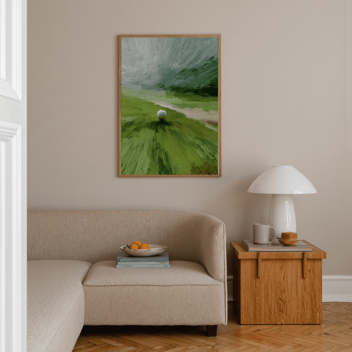 Abstract Green wall art with a golf ball on a tee in green and grey tones above a wooden side table