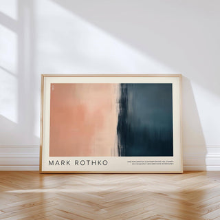 Framed Color Block Wall Art with abstract amber and dark blue blocks leaning on a wood floor