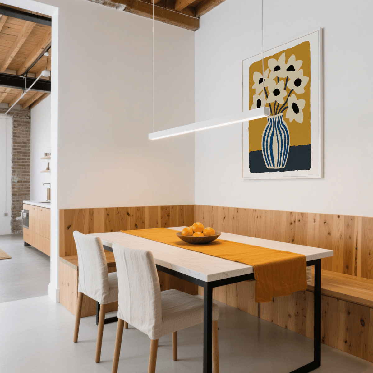 Art Print Flowers hanging on a white wall above a dining table with a bowl of fruit and mustard runner