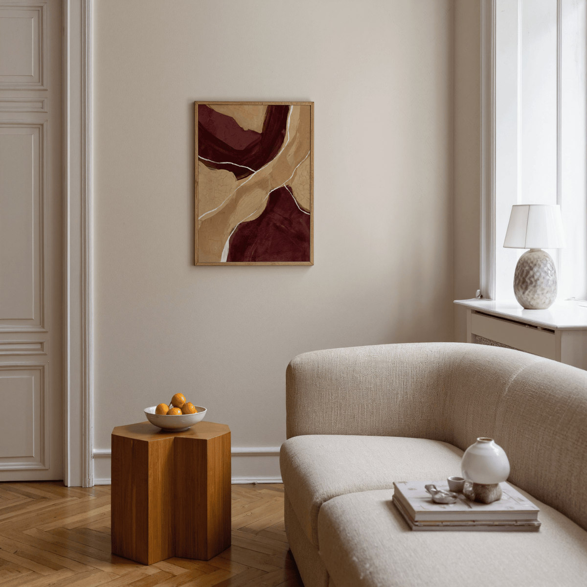 Neutral Organic Abstract Art on a wall in a living room with beige sofa and wooden side table with fruit bowl