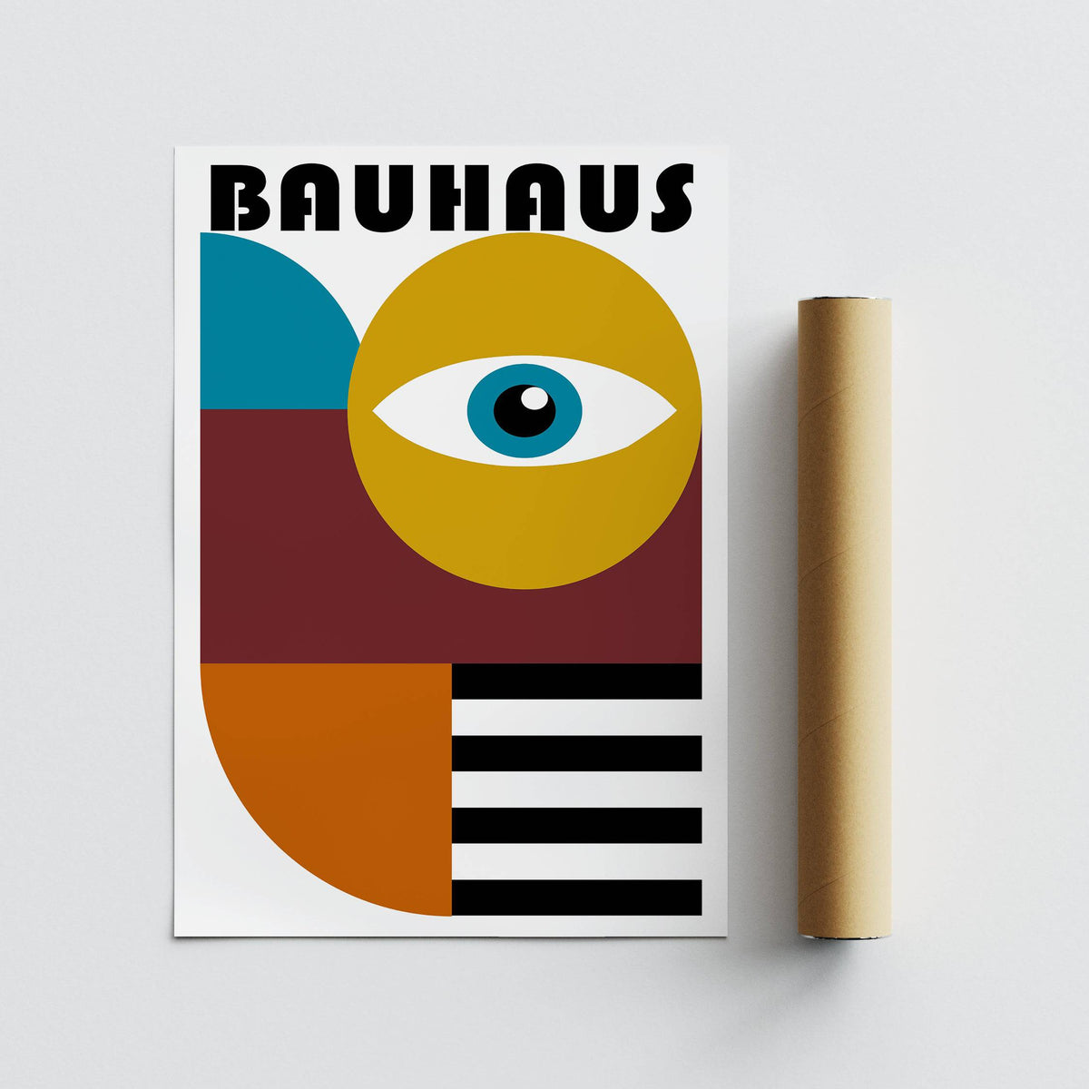 Retro wall art with stylised eye and geometric shapes beside a packaging tube on a grey surface