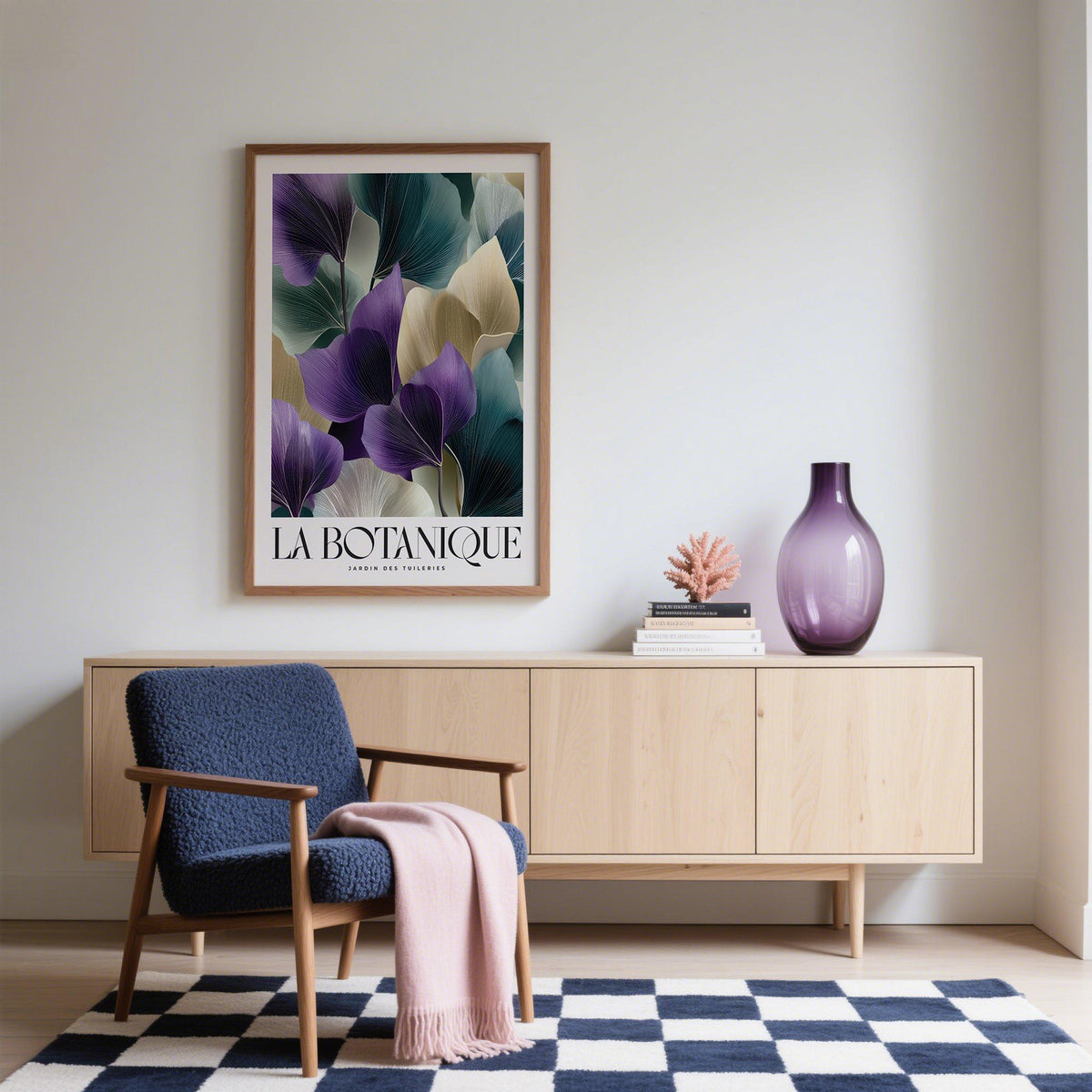 Leaf art prints with abstract botanical leaves in purple and green above a light wood sideboard in a sitting room