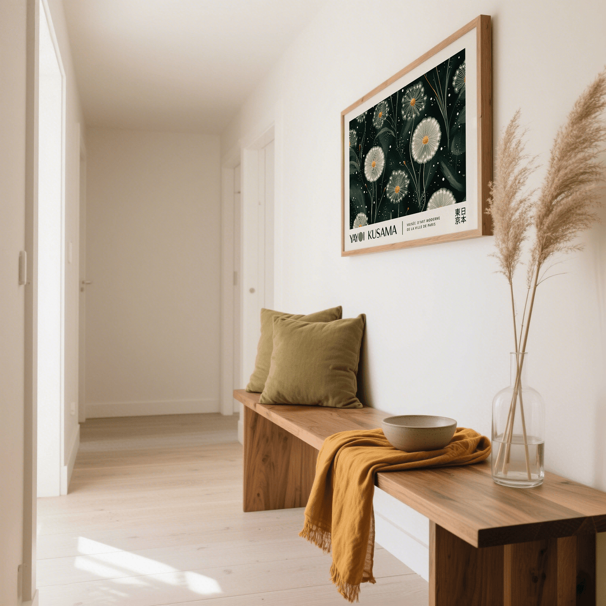 Emerald Green wall art of white dandelion seed heads in a natural wood frame above a bench with cushions and a vase
