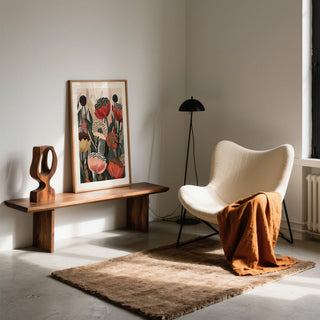 Print with abstract stylized flower bouquet leaning on a wooden bench with sculpture in a calm room