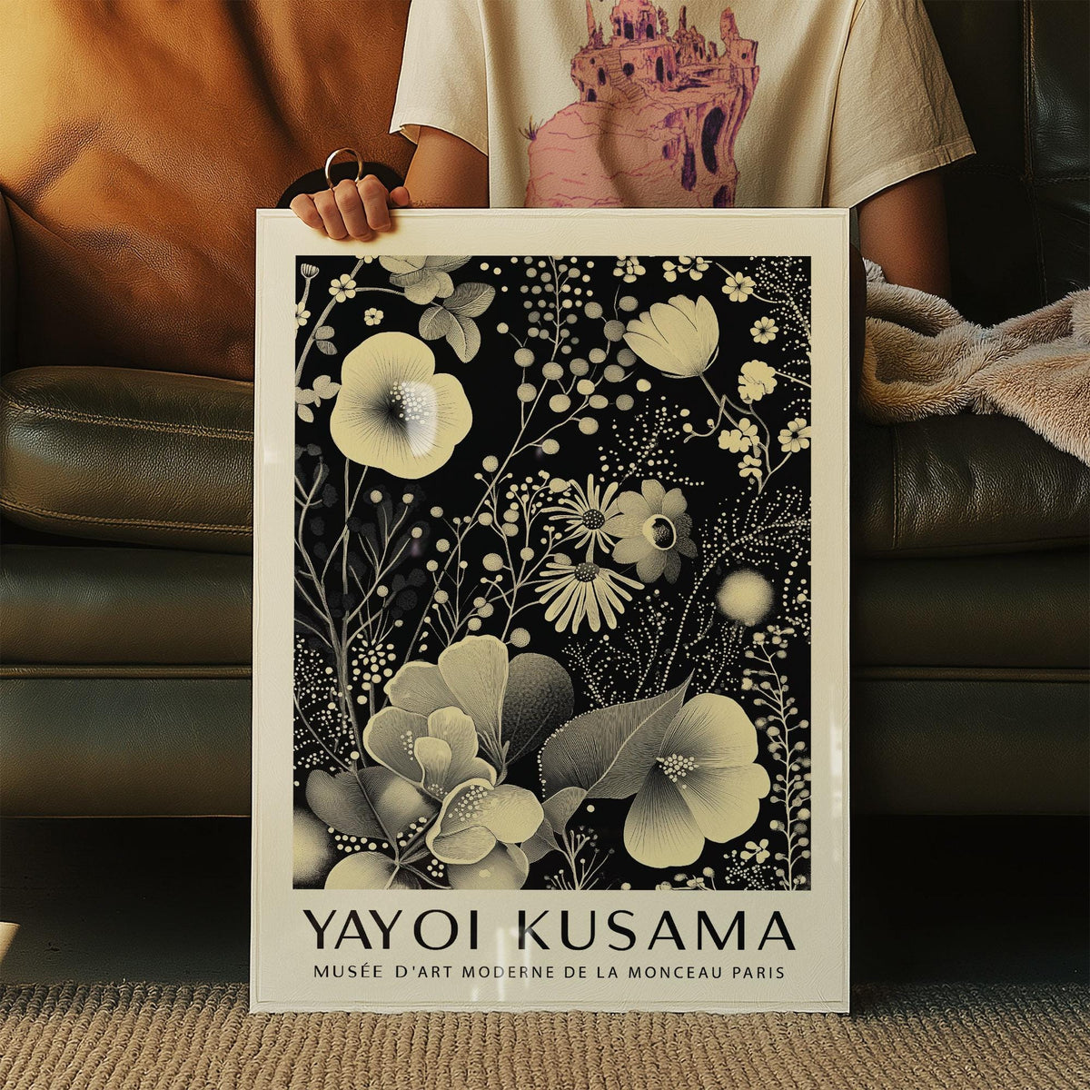 Large Floral Wall Art held in hands featuring an ivory floral pattern on a black background