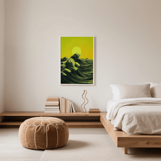Print on a wall in a bedroom with wave and sun abstract ocean art in green and yellow next to a beige pouf