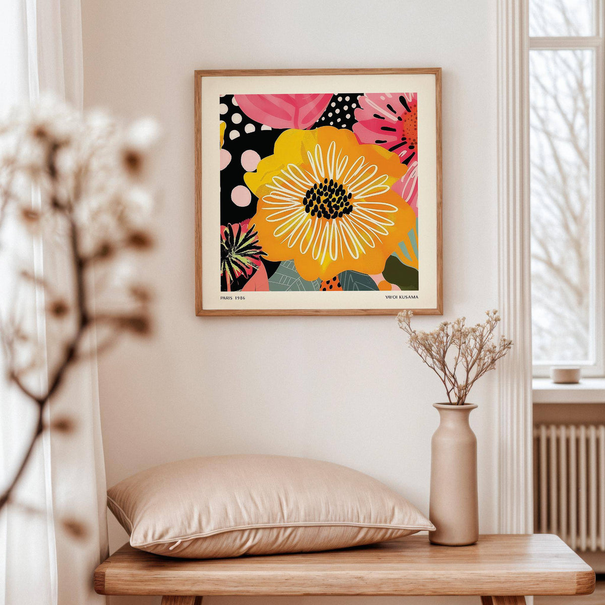Flower Posters hung on cream wall with dried flowers in a beige vase on wooden table